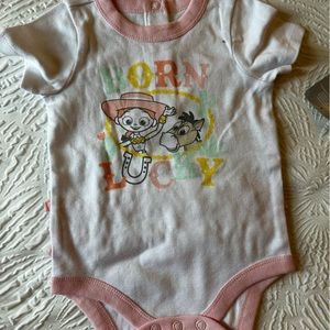 New Disney Baby Onesie . Jessie & Bullseye “Born Lucky”NWT